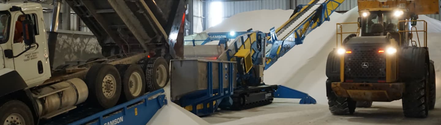 Machinery being operated in a warehouse.